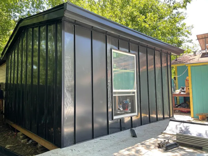 Black standing seam metal wall panels for Metal Roof Installation in Steamboat Springs