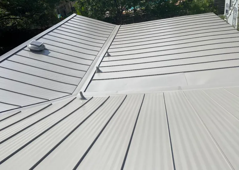 Solar attic fan installed on a metal roof for Roof Ventilation in Steamboat Springs